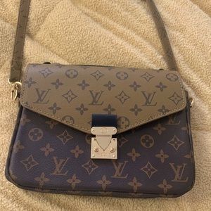 Brown and tan purse with adjustable strap